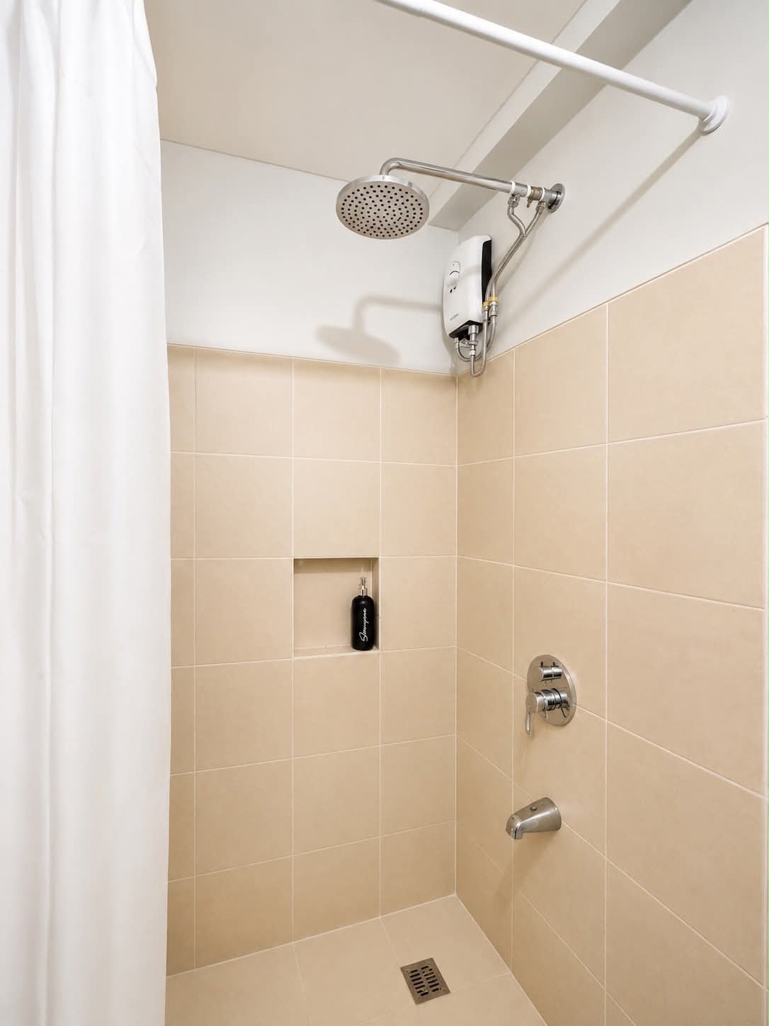 Walk-in shower with tiled walls